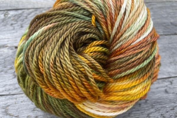 This photo provided by Ravenswood Fibre Co. shows some of their wool. Ravenswood Fibre Co's Sam Myhre celebrates the fall with her Autumn Grandeur colorway, a mix of softly-blended golds, rusts, greens and browns. (Ravenswood Fibre Co. via AP)