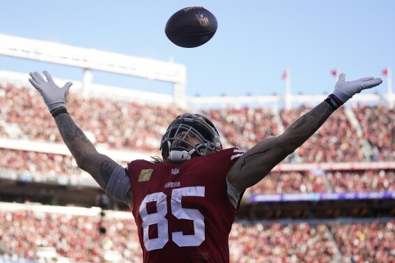 San Francisco 49ers tight end George Kittle (85) celebrates after scoring against the Tampa Bay Buccaneers during the second half of an NFL football game in Santa Clara, Calif., Sunday, Nov. 19, 2023. (AP Photo/Godofredo A. Vásquez)