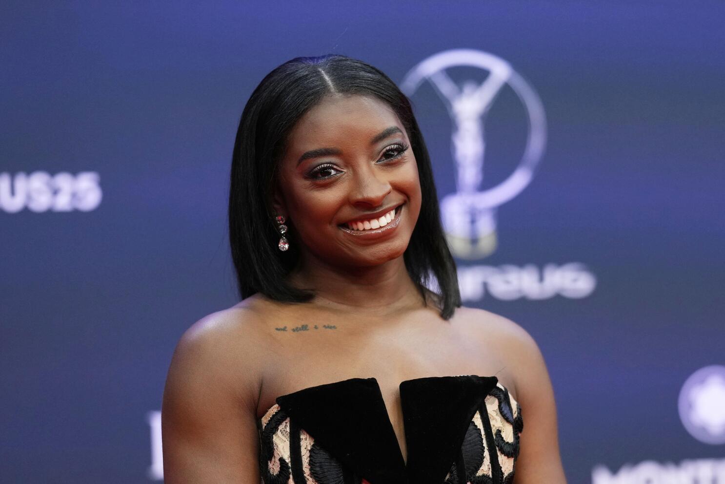 Simone Biles apologizes for heated exchange with Riley Gaines | AP News