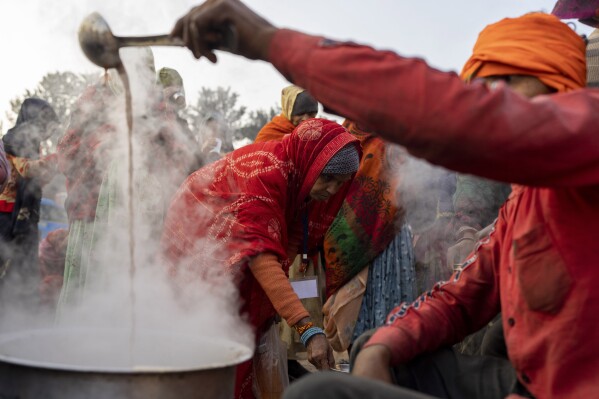 A cook prepares tea for pilgrims who are embarked on a visit to the sacred Pashupatinath temple in Kathmandu, Nepal, Jan. 9, 2024. The centuries-old temple is one of the most important pilgrimage sites in Asia for Hindus. Nepal and India are the world’s two Hindu-majority nations and share a strong religious affinity. Every year, millions of Nepalese and Indians visit Hindu shrines in both countries to pray for success and the well-being of their loved ones. (AP Photo/Niranjan Shrestha)