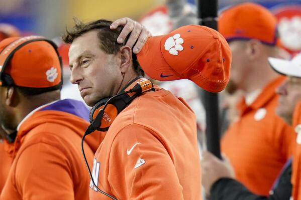 Clemson head coach Dabo Swinney wipes his head as he watches as his team play against Pittsburgh in the second half of an NCAA college football game, Saturday, Oct. 23, 2021, in Pittsburgh. Pittsburgh won 27-17. (AP Photo/Keith Srakocic)