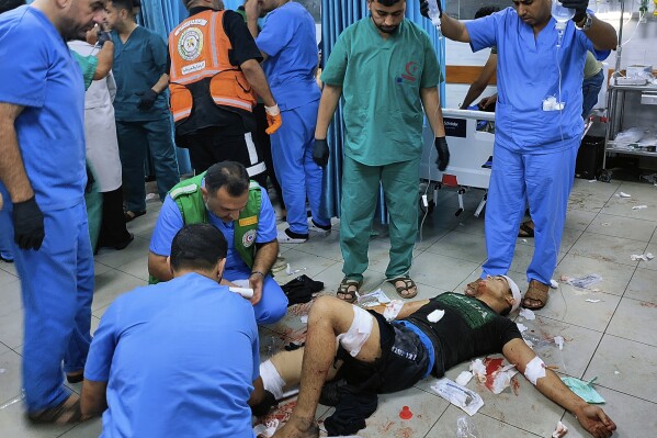 A wounded Palestinian man receives treatment at Kama Adwan hospital following Israeli bombardment on a UN school used as shelter, in Jabaliya, on the outskirts of Gaza City, Thursday, Nov. 2, 2023. (AP Photo/Abdul Qader Sabbah)