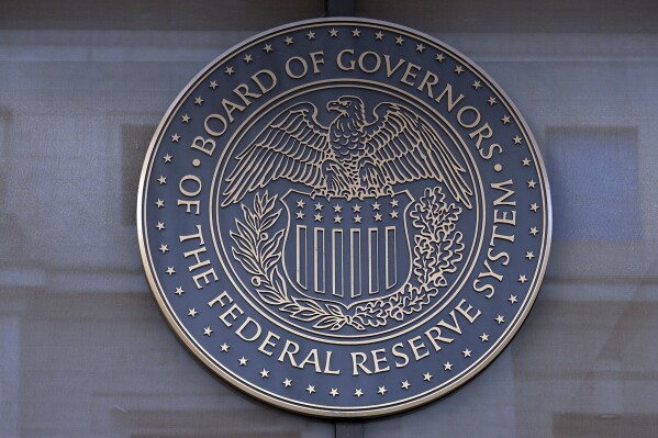 The seal of the Federal Reserve Board is seen at the Building in Washington, Saturday, Dec. 8, 2024. (AP Photo/Jose Luis Magana)