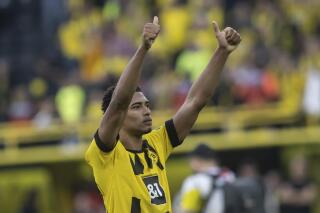 Dortmund's Jude Bellingham waves to supporters after the German Bundesliga soccer match between Borussia Dortmund and Borussia Moenchengladbach in Dortmund, Germany, Saturday, May 13, 2023. (Bernd Thissen/dpa via AP)