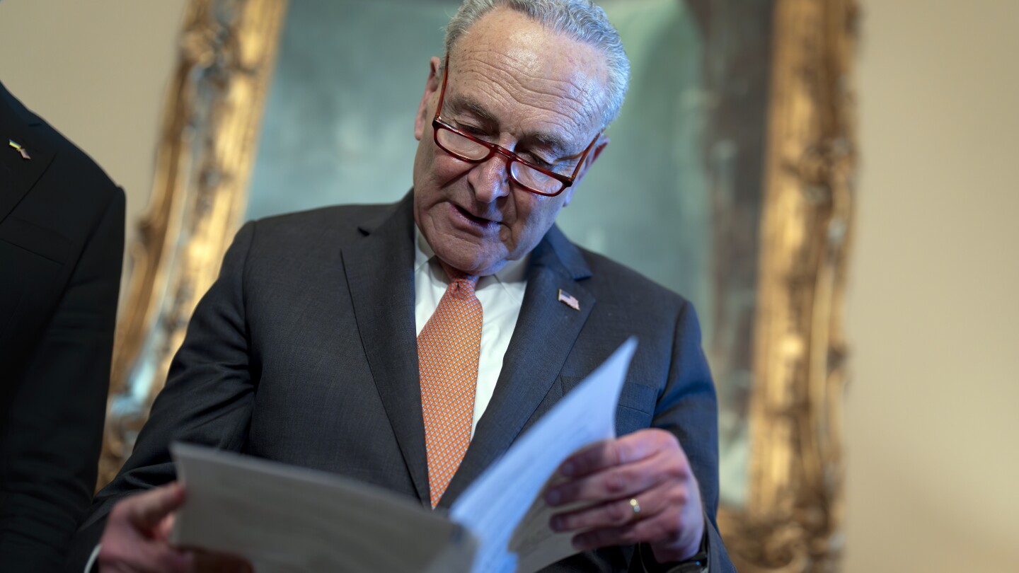 Senate Majority Leader Chuck Schumer, D-N.Y., looks over his notes during a meeting with Ukraine’s Prime Minister Denys Shmyhal as Congress moves to