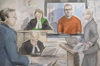 FILE - In this May 10, 2018 file photo of a courtroom sketch, from left, defense lawyer Boris Bytensky, Justice Ruby Wong, Alek Minassian and Crown prosecutor Joe Callaghan are shown in court as Minassian appears by video in Toronto, Canada. Minassian, who admitted using a van to kill 10 pedestrians in Toronto on April 23, 2018, was found guilty on Wednesday, March 3, 2021. (Alexandra Newbould/The Canadian Press via AP, File)
