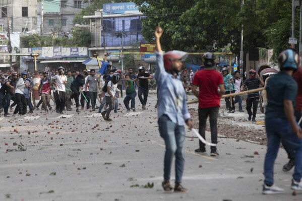 Students clash over quota system at Jahangir Nagar University at Savar outside Dhaka, Bangladesh, Monday, July 15, 2024. Police have fired tear gas and charged with batons overnight during violent clashes between a pro-government student body and student protesters, leaving dozens injured at a leading public university outside Bangladesh's capital over quota system in government jobs, police and students said Tuesday.(AP Photo/Abdul Goni)