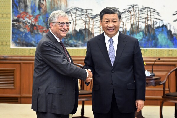 In this photo released by China's Xinhua News Agency, Bill Gates, left, meets with Chinese President Xi Jinping in Beijing, Friday, June 16, 2023. Microsoft's co-founder Bill Gates has met with Chinese President Xi Jinping just days after a visit to Beijing by Tesla CEO Elon Musk. The state broadcaster CCTV showed Xi saying he was happy to see Gates, who he called an "old friend," after three years without meeting during the pandemic. (Yin Bogu/Xinhua via AP)