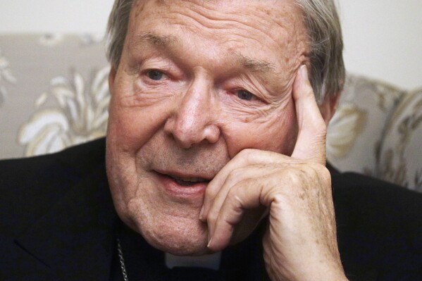 FILE - Cardinal George Pell answers' a journalists question during an interview with the Associated Press inside his residence near the Vatican in Rome, Nov. 30, 2020. The Catholic Church in Australia has lost a court bid, Friday, Aug. 25, 2023, to prevent a choirboy's father from suing over an allegation that Cardinal George Pell sexually abused their teenage son. (AP Photo/Gregorio Borgia, File)