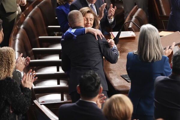 Rep. Nancy Pelosi, D-Calif., center, hugs House Minority Leader Hakeem Jeffries, D-N.Y., after casting her vote for him as the House of Representatives meets to elect a speaker and convene the new 119th Congress at the Capitol in Washington, Friday, Jan. 3, 2025. (AP Photo/Jacquelyn Martin)