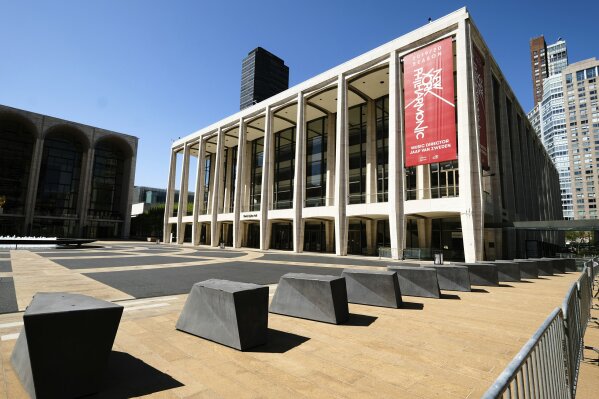 FILE - This May 12, 2020 file photo shows David Geffen Hall at Lincoln Center, closed during COVID-19 lockdown, in New York. The New York Philharmonic has launched an on-demand video and audio streaming service Monday called NYPhil+ that is available for $50 annually or $4.99 monthly.  (Photo by Evan Agostini/Invision/AP, File)