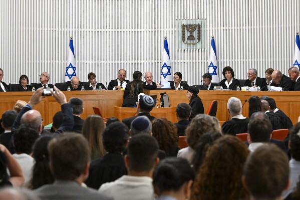 FILE - All 15 of Israel's Supreme Court justices appear for the first time in the country's history to look at the legality of Prime Minister Benjamin Netanyahu's contentious judicial overhaul, which the government pushed through parliament in July, in Jerusalem, on Sept. 12, 2023. The Israeli government has complained to Germany after the German ambassador attended a high-profile Supreme Court hearing last week looking at the legality of Netanyahu’s judicial overhaul, an Israeli diplomatic official said Monday Sept. 18, 2023. (Debbie Hill/Pool Photo via AP, File)