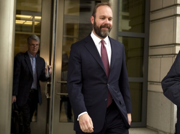 
              Rick Gates leaves federal court in Washington, Friday, Feb. 23, 2018. Gates, a former top adviser to President Donald Trump's campaign pleaded guilty in the special counsel's Russia investigation to federal conspiracy and false statements charges. (AP Photo/Jose Luis Magana)
            