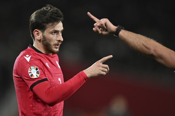 FILE - Georgia's Khvicha Kvaratskhelia argues with referee during the Euro 2024 qualifying play-off soccer match between Georgia and Greece at the Boris Paichadze National Stadium in Tbilisi, Georgia, Tuesday, March 26, 2024. The Associated Press takes a look at some of the players expected to light up the European Championship in Germany which kicks off on June 14. (AP Photo/Tamuna Kulumbegashvili, File)