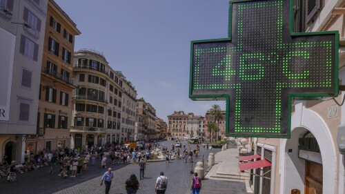 A Pharmacy shop sign displays the outside temperature of 46 Celsius degrees (114.8 F) in downtown Rome, Tuesday, July 18, 2023. Temperatures in Italy are officially registered only by the Italian Air Force's weather service while high temperatures picked by private stations need to be verified by the World Meteorological Organization, which only Monday accepted a new temperature record for continental Europe of 48.8 Celsius degrees (119.8 F), measured in Sicily on Aug. 11, 2021. (AP Photo/Domenico Stinellis)