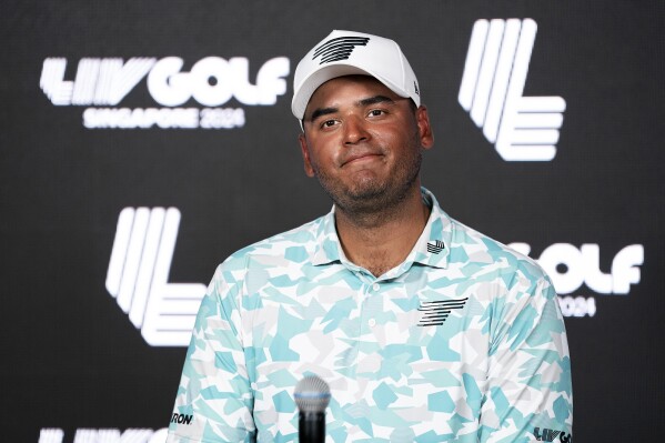 Sebastián Muñoz of Torque GC speaks at a press conference during the first round of LIV Golf Singapore at Sentosa Golf Club Friday, May 3, 2024, in Sentosa, Singapore. Munoz of Colombia shot a 6-under 65 on Friday to lead after the first round. (Hailey Garrett/LIV Golf via AP)