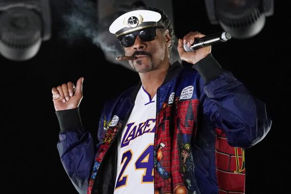 FILE - Snoop Dogg performs a DJ set as "DJ Snoopadelic" during the "Concerts In Your Car" series on Oct. 2, 2020, in Ventura, Calif.  The rapper will join Def Jam Recordings as an executive creative and strategic consultant. (AP Photo/Chris Pizzello, File)