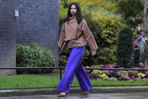 FILE - Britain's Home Secretary Suella Braverman arrives for a cabinet meeting in 10 Downing Street in London, on Oct. 31, 2023. Britain’s interior minister has accused the country’s largest police force of being more lenient towards pro-Palestinian protests than other groups, deepening a political feud sparked by the Israel-Hamas war. In a highly unusual attack on the police, Home Secretary Suella Braverman said London’s Metropolitan Police force was ignoring lawbreaking by “pro-Palestinian mobs.” She called demonstrators calling for a cease fire in Gaza “hate marchers.” (AP Photo/Kirsty Wigglesworth)