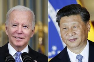 FILE - This combination image shows U.S. President Joe Biden in Washington, Nov. 6, 2021, and China's President Xi Jinping in Brasília, Brazil, Nov. 13, 2019. President Biden says he hopes to use an anticipated meeting with China’s President Xi Jinping to discuss growing tensions between Washington and Beijing over the self-ruled island of Taiwan, trade policies and Beijing’s relationship with Russia. The White House has said that it is working with Chinese officials to arrange a meeting between Biden and Xi on the sidelines of next week’s Group of 20 Summit in Bali, Indonesia. (AP Photo/Alex Brandon, Eraldo Peres, File)