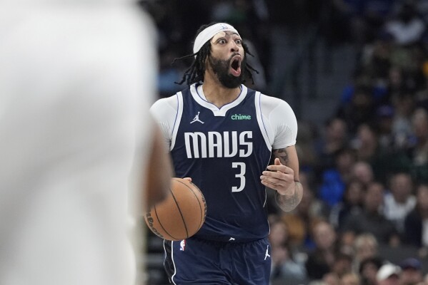 Dallas Mavericks forward Anthony Davis (3) dribbles the ball during the second half of an NBA basketball game against the Atlanta Hawks in Dallas, Wednesday, April 2, 2025. (AP Photo/LM Otero)