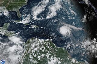 FILE - This satellite image provided by the National Oceanic and Atmospheric Administration shows Hurricane Sam, center right, in the Atlantic Ocean, Monday, Sept. 27, 2021, at 3:20 p.m. ET. On Tuesday, May 24, 2022, federal meteorologists say the Atlantic should expect another extra busy hurricane season in 2022. Tuesday's National Oceanic and Atmospheric Administration's Atlantic hurricane season forecast calls for 14 to 21 named storms, with six to 10 becoming hurricanes. (NOAA via AP, File)