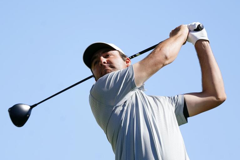 Scottie Scheffler hits his tee shot at the third hole during the final round of the Phoenix Open golf tournament Sunday, Feb. 13, 2022, in Scottsdale, Ariz. Scheffler won the tournament in a playoff against Patrick Cantlay. (AP Photo/Ross D. Franklin)