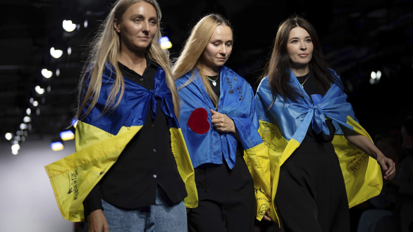 Far from home, Ukrainian designers showcase fashion created amid air raid sirens