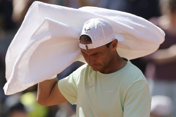Spain's Rafael Nadal uses his towel as he trains at the Roland Garros stadium, Saturday, May 25, 2024 in Paris. The French Open tennis tournament starts Sunday May 26, 2024. (AP Photo/Jean-Francois Badias)