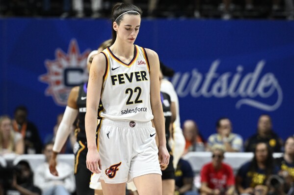 Indiana Fever guard Caitlin Clark (22) walks down the court after a turnover against the Connecticut Sun during the second quarter of a WNBA basketball game, Tuesday, May 14, 2024, in Uncasville, Conn. (AP Photo/Jessica Hill)