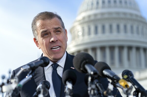 Hunter Biden, son of U.S. President Joe Biden, talks to reporters at the U.S. Capitol, in Washington, Dec. 13, 2023. Prosecutors say a former FBI informant charged with making up a multimillion-dollar bribery scheme involving President Joe Biden, his son Hunter and a Ukrainian energy company had contacts with officials affiliated with Russian intelligence.(AP Photo/Jose Luis Magana, File)