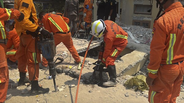 Rescuers work at U Hla Thein Buddhist monastery that collapsed in Friday's earthquake in Mandalay, Myanmar, Monday, March 31, 2025. (AP Photo)