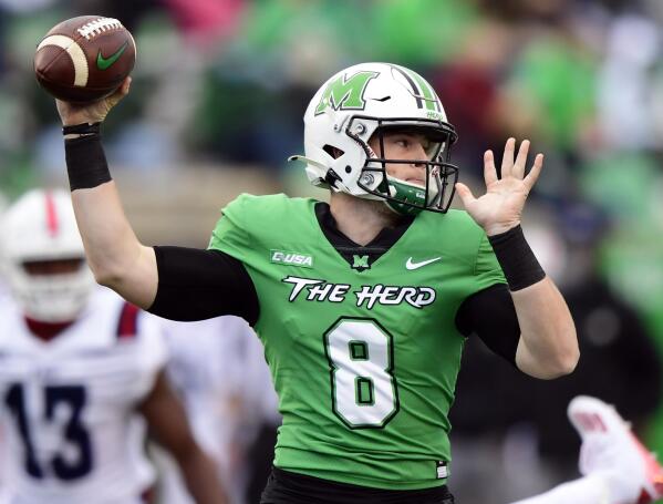 FILE - In this Oct. 24, 2020, file photo, Marshall Thundering Herd quarterback Grant Wells (8) makes a pass during an NCAA football game against the Florida Atlantic Owls on Saturday, Oct. 24, 2020 in Huntington, W.Va. Wells hopes to lead Marshall to a return to the Conference USA championship game, where the Thundering Herd lost a year ago to UAB. (AP Photo/Emilee Chinn, File)
