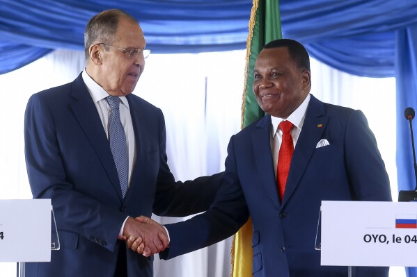 In this photo released by Russian Foreign Ministry Press Service, Russian Foreign Minister Sergey Lavrov, left, and Congo's Foreign Minister Jean Claude Gakosso shake hands after a joint news conference in Oyo, Congo, Tuesday, June 4, 2024. (Russian Foreign Ministry Press Service via AP)