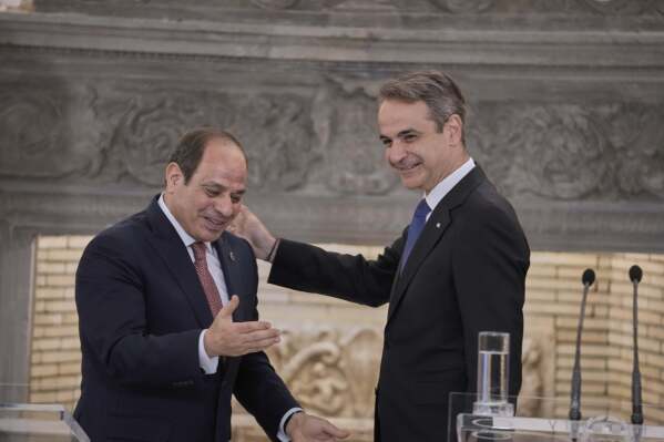 Greece's Prime Minister Kyriakos Mitsotakis, right, and Egyptian President Abdel-Fattah el-Sissi gesture during a joint news conference in Athens, on Wednesday, May 7, 2025. (AP Photo/Petros Giannakouris)