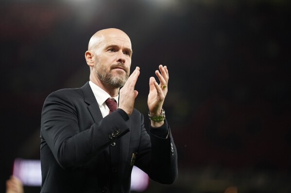 Manchester United's head coach Erik ten Hag applauds supporters at the end of the English Premier League soccer match between Manchester United and Newcastle United, in Manchester, England, Wednesday, May 15, 2024. (AP Photo/Dave Thompson)