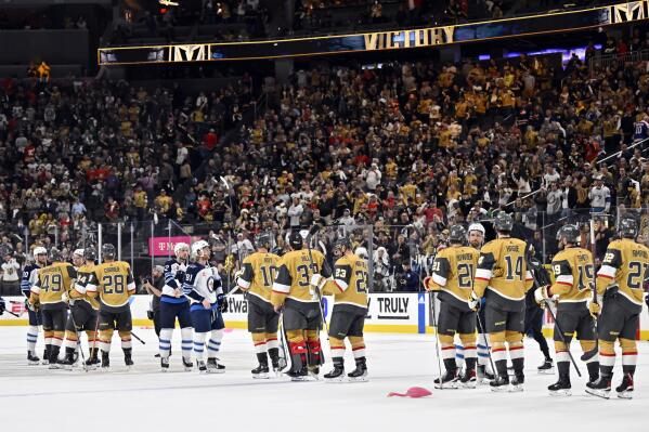Vegas Golden Knights and Winnipeg Jets shake hands after the Golden Knights defeated the Jets 4-1 in Game 5 of an NHL hockey Stanley Cup first-round playoff series Thursday, April 27, 2023, in Las Vegas. The Golden Knights won the series. (AP Photo/David Becker)