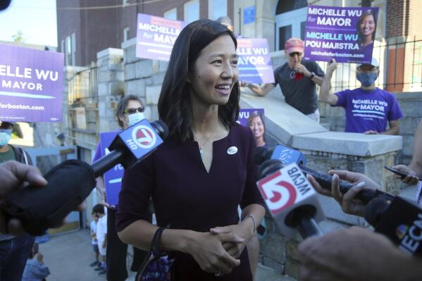 Boston mayoral candidate Michelle Wu speaks with the media after casting her ballot in the Mayoral race on Election Day, at the Phineas Bates Elementary School in Boston, Tuesday, Sept. 14, 2021. (AP Photo/Stew Milne)