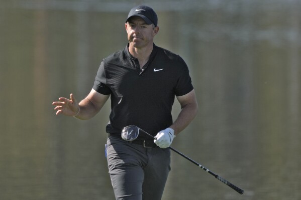 Rory McIlroy, of Northern Ireland, reacts after his shot went into the water on the 18th hole during the first round of The Players Championship golf tournament Thursday, March 14, 2024, in Ponte Vedra Beach, Fla. (AP Photo/Lynne Sladky)