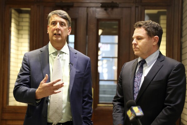 Maryland state Sen. Guy Guzzone, left, talks about a budget agreement reached on the state's $63 billion budget with Del. Ben Barnes during an availability with journalists, Wednesday, April 3, 2024 in Annapolis, Md. (AP Photo/Brian Witte)