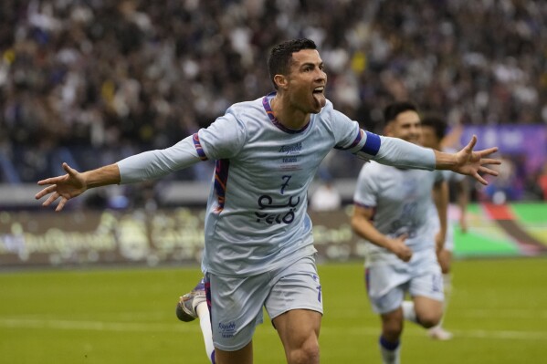 FILE - Cristiano Ronaldo celebrates after scoring his side's second goal playing for a combined XI of Saudi Arabian teams Al Nassr and PSG during a friendly soccer match, at the King Saud University Stadium, in Riyadh, Saudi Arabia, Thursday, Jan. 19, 2023. Cristiano Ronaldo has come under heavy criticism after seemingly making an offensive gesture following Al Nassr’s 3-2 victory over Al Shabab in a Saudi Pro League match on Sunday, Feb. 25, 2024. (AP Photo/Hussein Malla, File)