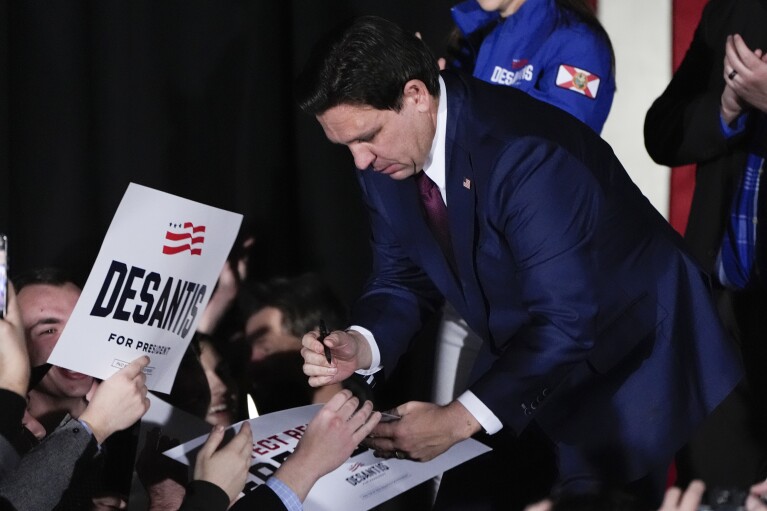 Republican presidential candidate Florida Gov. Ron DeSantis greets supporters during a caucus night party, Monday, Jan. 15, 2024, in West Des Moines, Iowa. (AP Photo/Charlie Neibergall)