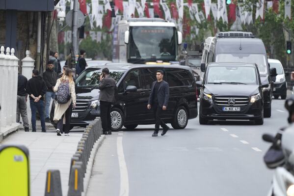 Vehicles begin arriving outside a gate prior to expected talks between Russian and Ukrainian delegations at the Dolmabache palace, in Istanbul, Turkey, Friday, May 16, 2025. (AP Photo/Dilara Acikgoz)