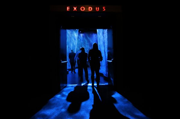 
              A door opens to the "Exodus" section inside the Museum of the Bible, Monday, Oct. 30, 2017, in Washington. The project is largely funded by the conservative Christian owners of the Hobby Lobby crafts chain. Hobby Lobby president Steve Green says the aim is to educate not evangelize. But skeptics call the project a Christian ministry disguised as a museum. (AP Photo/Jacquelyn Martin)
            