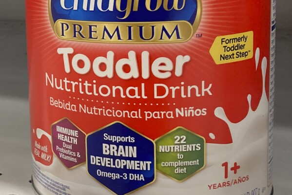 FILE - A can of toddler nutritional drink sits on a shelf in a grocery store in Surfside, Fla., on Friday, June 17, 2022. Powdered drink mixes that are widely promoted as “toddler milks” for older babies and children up to age 3 are unregulated, unnecessary and “nutritionally incomplete,” the American Academy of Pediatrics warned Friday, Oct. 20, 2023 (AP Photo/Wilfredo Lee, File)