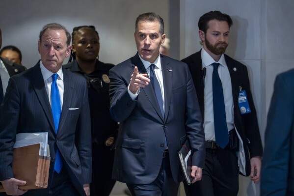 Hunter Biden, son of President Joe Biden, with attorney Abbe Lowell, left, leaves after a closed-door deposition in the Republican-led investigation into the Biden family, on Capitol Hill in Washington, Wednesday, Feb. 28, 2024. (AP Photo/J. Scott Applewhite)