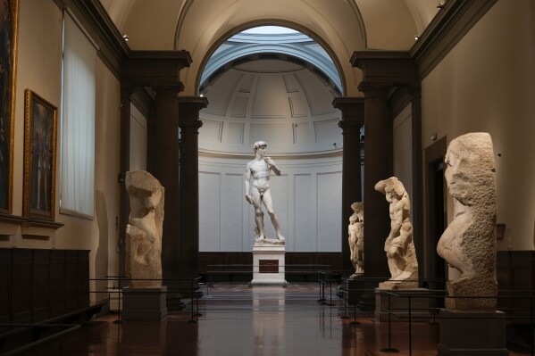 Michelangelo's 16th century statue of David is seen on display at the Accademia gallery, in Florence, central Italy, Monday, March 18, 2024. Michelangelos David has been a towering figure in Italian culture since its completion in 1504. But curators worry the marble statues religious and political significance is being diminished by the thousands of refrigerator magnets and other souvenirs focusing on Davids genitalia. The Galleria dellAccademias director has positioned herself as Davids defender and takes swift aim at those profiteering from his image. (AP Photo/Andrew Medichini)