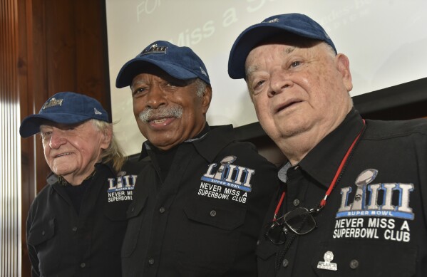 FILE - Members of the Never Miss a Super Bowl Club, from the left, Tom Henschel, Gregory Eaton, and Don Crisman pose for a group photograph during a welcome luncheon, in Atlanta, Friday, Feb. 1, 2019. As long as they still have each other, they're still going to go to every Super Bowl. That's the sentiment shared by the three friends who say they are the final fans who can claim membership in the exclusive 鈥渘ever missed a Super Bowl鈥� club. And they're back again for number 58 鈥� Super Bowl 58 鈥� this year. (Hyosub Shin/Atlanta Journal-Constitution via AP, File)