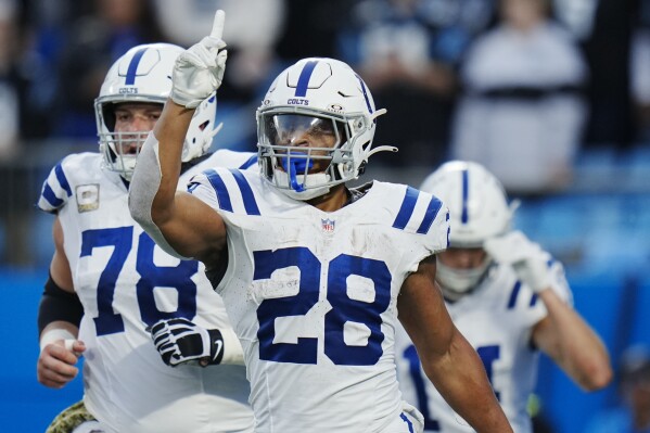 Indianapolis Colts running back Jonathan Taylor celebrates after scoring against the Carolina Panthers during the first half of an NFL football game Sunday, Nov. 5, 2023, in Charlotte, N.C. (AP Photo/Rusty Jones)