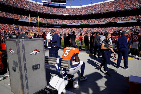 Broncos overcome Teddy Bridgewater's injury with stiff defense to