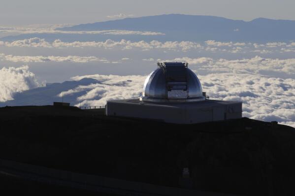 FILE - This July 14, 2019, file photo shows a telescope at the summit of Mauna Kea, Hawaii's tallest mountain. A judicial decision from Spain's Canary Islands has put a halt on an alternative plan to build a giant telescope unpopular in Hawaii, which is the preferred location. Construction of the Thirty Meter Telescope on Hawaii's tallest mountain, Mauna Kea, has been stalled by opponents who say the project will desecrate land that's sacred to some Native Hawaiians. If it can't be built in Hawaii, telescope officials have selected the alternate location on the highest mountain of La Palma, a Spanish island off Africa's western coast. But a court there ruled last month in a decision that just emerged that a public concession for the site was invalid. . (AP Photo/Caleb Jones, File)